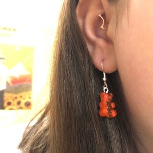 Red gummy bear earrings.